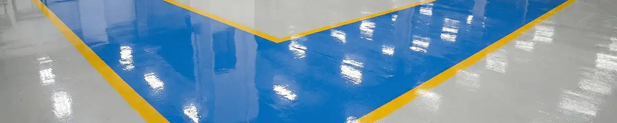 A factory floor professionally covered and marked with epoxy flooring in Green Bay, WI