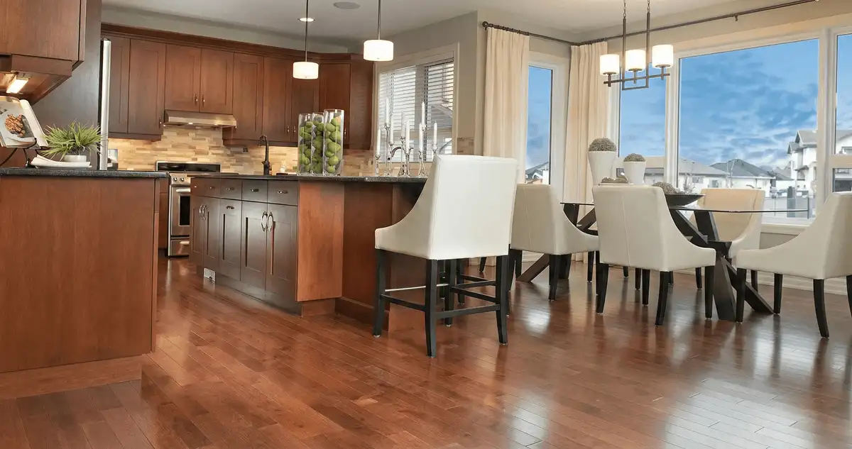 A modern kitchen with professionally installed wood flooring in Green Bay, WI