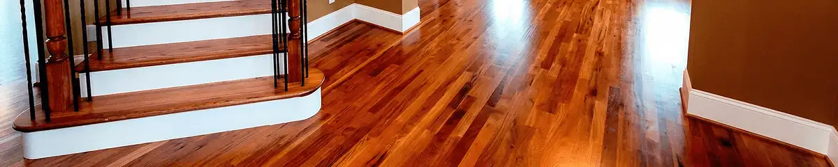 Base floor of a staircase with professionally restored wood flooring in Green Bay WI