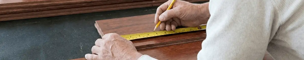 A professional installing wood flooring in Green Bay, WI